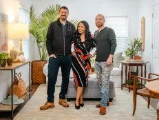 As seen on HGTV's Bargain Block, Keith Bynum, Shea Hicks-Whitfieldpose, and Evan Thomas pose in the living room of the Hampton House.